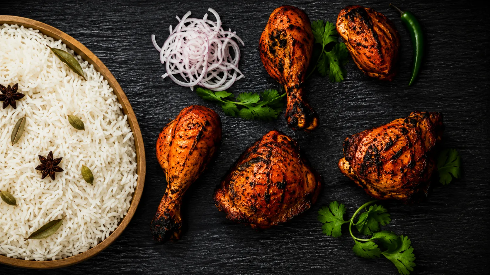 Indian tandoori chicken starter with onions, lime and mint chutney at Biryani Unlimited in Shawnessy, Calgary